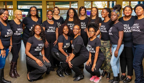 A photo of representatives of the Foundation for Black Women's Wellness wearing 