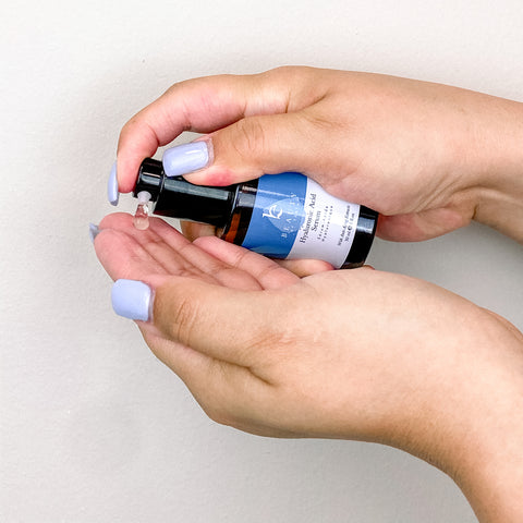 Pumping Hyaluronic Serum in hand