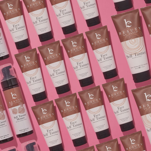 Images of several types of beauty by earth tanning products on a pink background