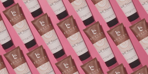 Image of several BBE self tanners on a pink background.