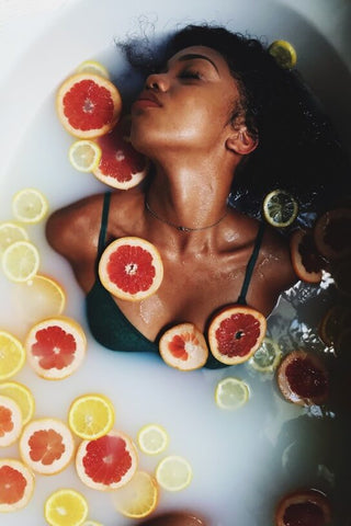woman taking a Milk bath rich in Vitamin D