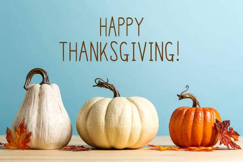 Thanksgiving message with pumpkins on a blue background.