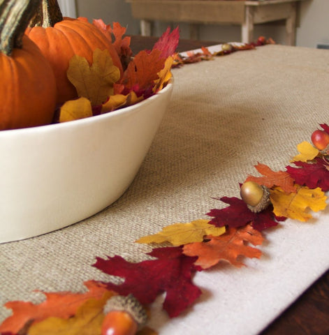 Image of a fall themed table runner made with real leaves that is eco-friendly.