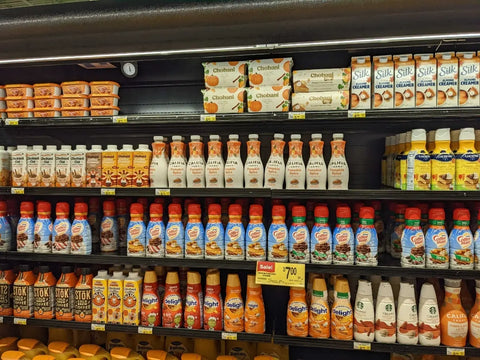 A grocery store aisle filled with pumpkin spice flavored everything – cereals, cookies, coffee, etc.