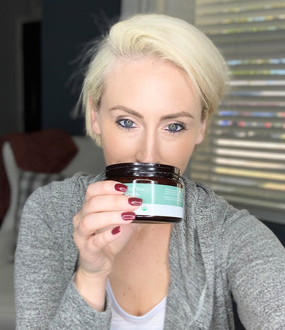 Image of a happy BBE customer smelling the delicious peppermint tea tree body scrub.