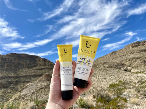 body and face sunscreen in hand 