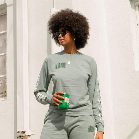 Image of a woman wearing the Mas Cafe sweatpant set from Lights the Label, a hispanic-owned brand.