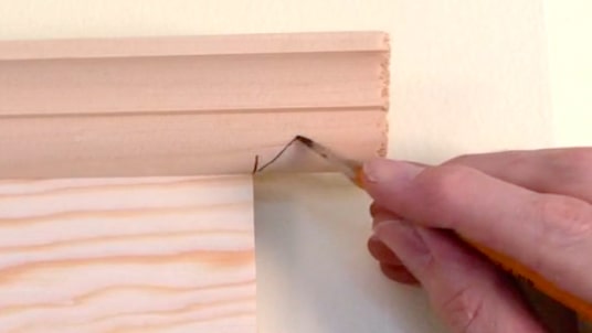 Measure trim length and mark to indicate the angle of the cut