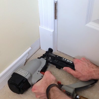 Install plinth block at the bottom of the door trim