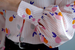 Puffy gathered sleeve into cuff with two buttons