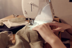 Sewing cloth at a sewing machine