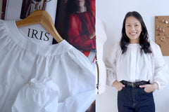 Lady wears a gathered at round neckline blouse, alongside image of blouse atop magazine pages
