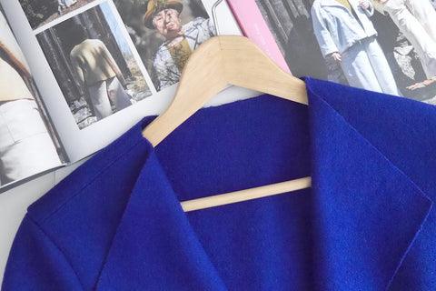 Unlined felted wool jacket on hanger