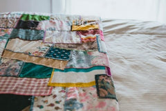 Patchwork quilt on bed