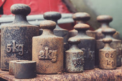 Variety of cast iron weights lined up