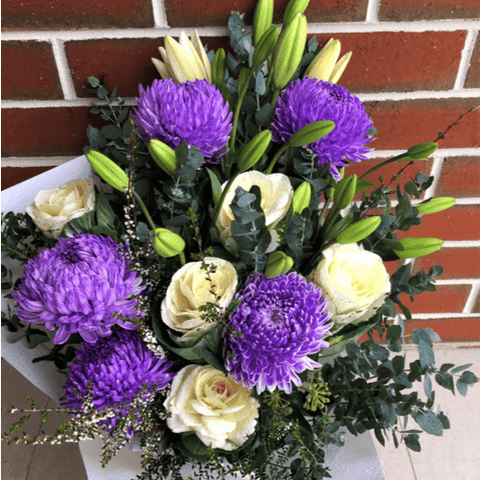 Bouquet of purple and white flowers.