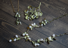 Handmade pearl necklace, earrings, and pin by artist Michael Michaud 