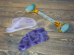 Rose quartz and amethyst gua sha tools with jade facial roller