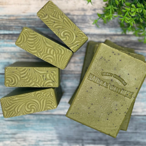 Green soap bars stamped with Smoky Mountain Natural Wellness logo