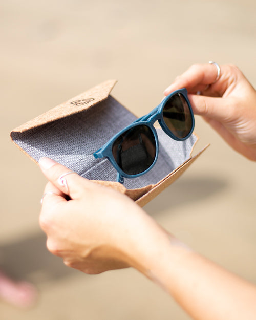 Waterhaul sunglasses being taken out of cork folding glasses case