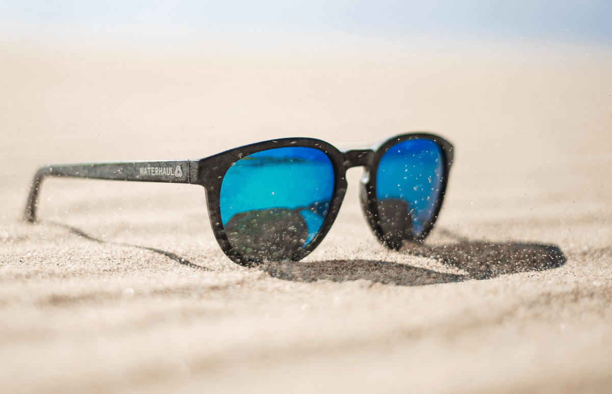 waterhaul scratch resistant sunglasses in sand on beach