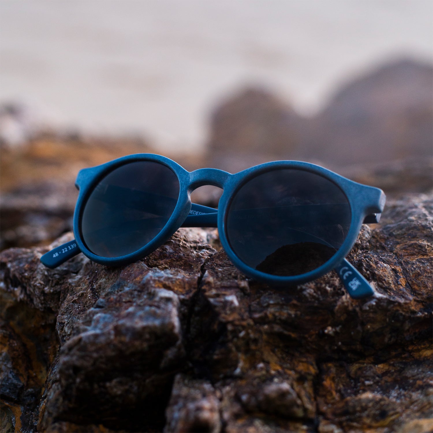 harlyn navy prescription sunglasses placed on rocks 