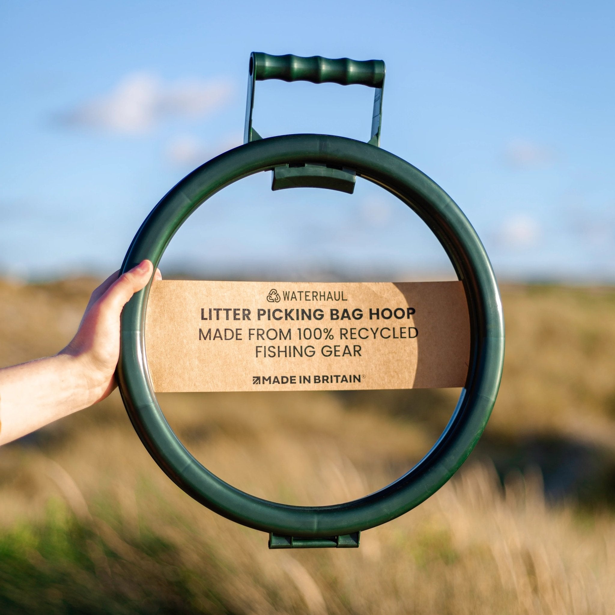 Folding litter picker made from recycled plastic on beach