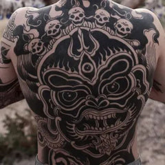tatouage bouddhiste monstre