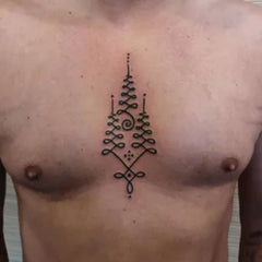 tatouage symbole bouddhiste torse