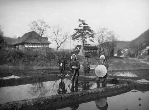 A photo of a family preparing rice fields taken by Ito Jintaro around 1930.