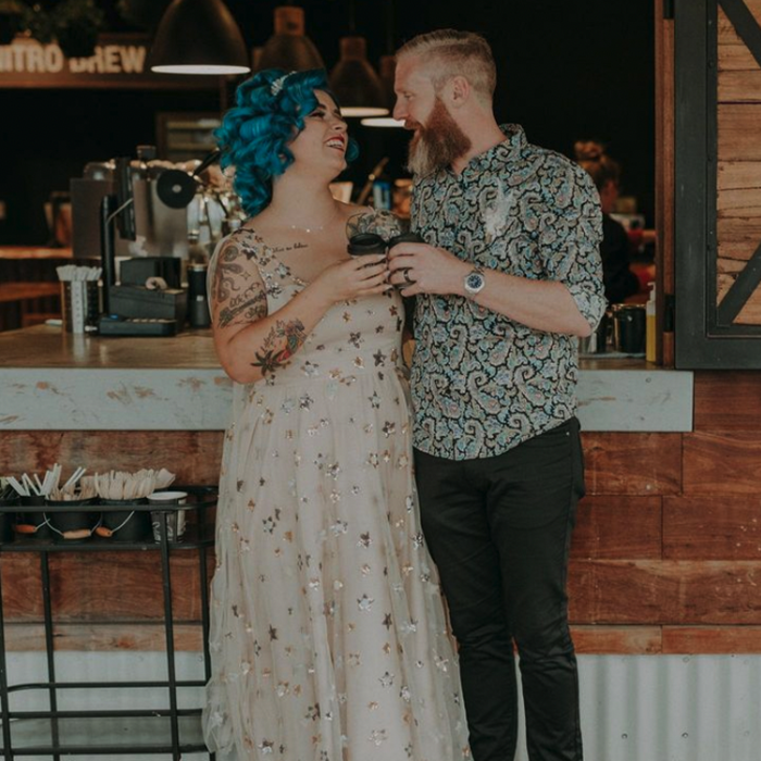 Keeley and her husband cheers with coffees