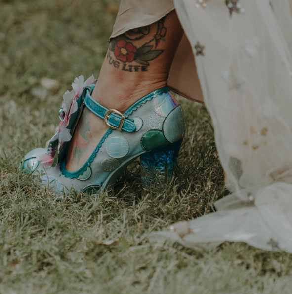 A side view of Keeley's shoes, showing the clear blue heel