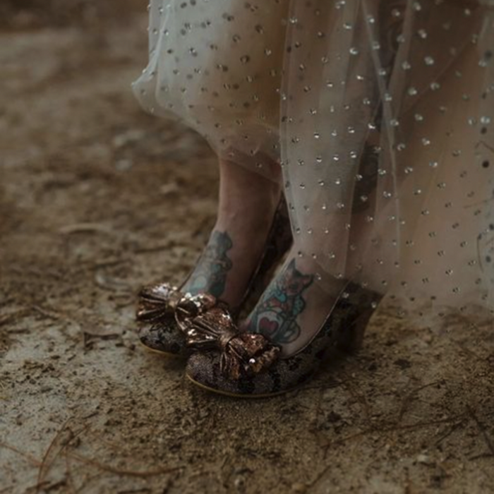 A closeup of Missy's shoes, which match her metallic dress perfectly