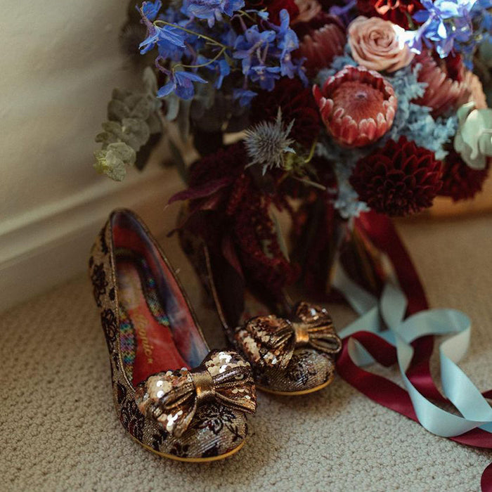 A closeup of Missy's shoes and her beautiful bouquet 