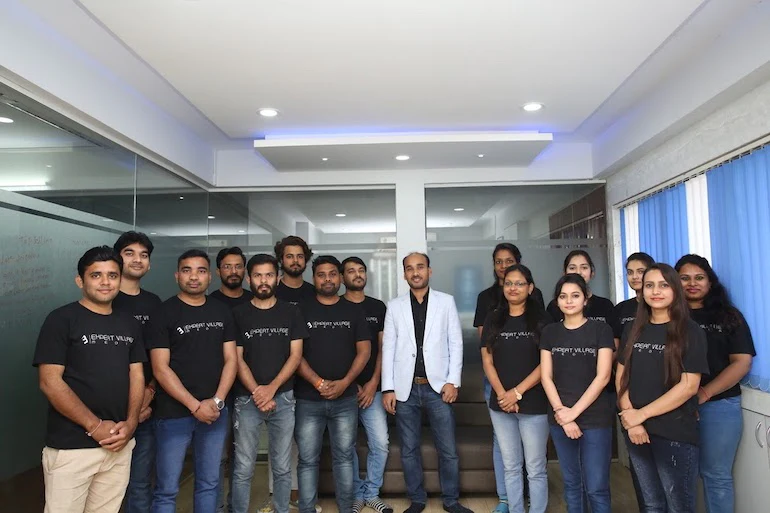 App performance: Photo of the 16 team members behind Shopify app Wiser. In this photo, eight men are on the left, seven women are on the right, and the founder, Amit Porwal, stands in the center wearing a white blazer while the rest of the team is wearing black t-shirts.