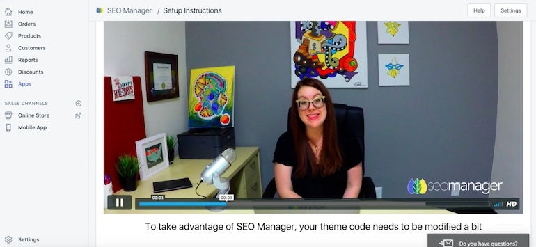 app user retention: Screenshot taken from a welcome video. The presenter is a woman and she's sitting behind a desk with a computer monitor close by