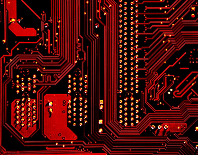 a enlarged, zoomed in photo of a motherboard, with the entire image cast in red