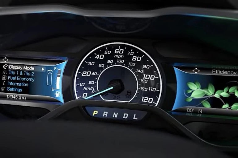 Microinteractions: Photo of the Ford dashboard in one of the car company's hybrid vehicles. It shows an efficiency indicator made up of leaves that grow on a vine as the driver operates the vehicle in an eco-friendly manner. 