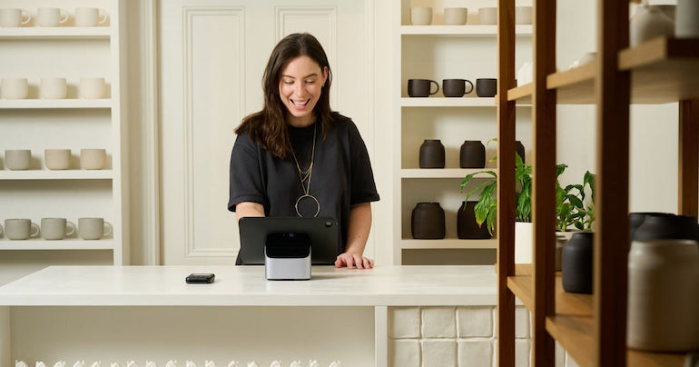 image of a woman working on a Shopify POS