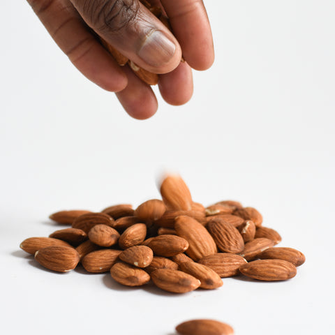 raw almonds in a hand