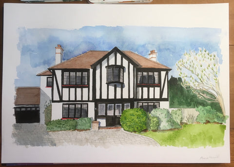 Watercolour house portrait - an A3 painting of a white house with black beams surrounded by a beautiful garden