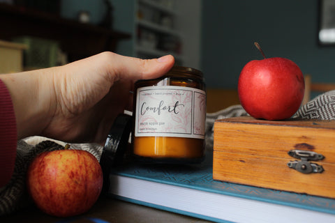Comfort warm apple pie scented soy wax candle in an amber glass jar hand poured in Belfast