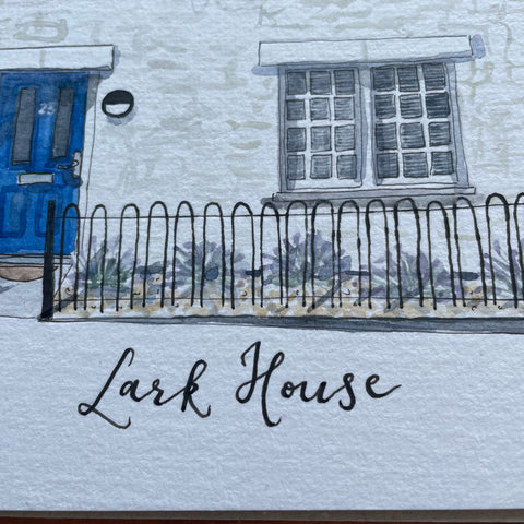 Hand calligraphy below watercolour house painting saying “lark house”