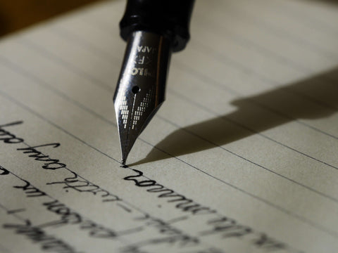 Fountain pen writing a letter