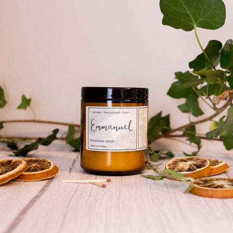 Emmanuel - a Christmas spice 8oz soy wax hand poured candle in an amber glass jar