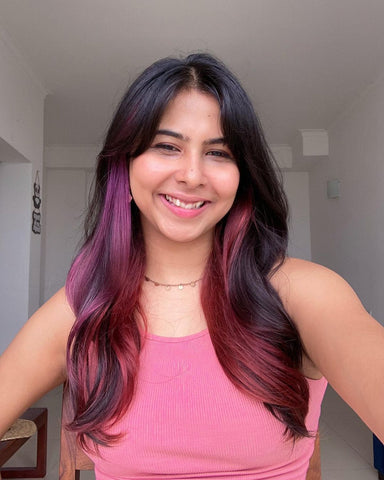 A girl with pekaboo highlights with color carola pink from Paradyes