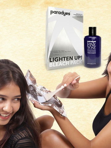 Girl with lighten up bleach pack and toning shampoo by Paradyes.