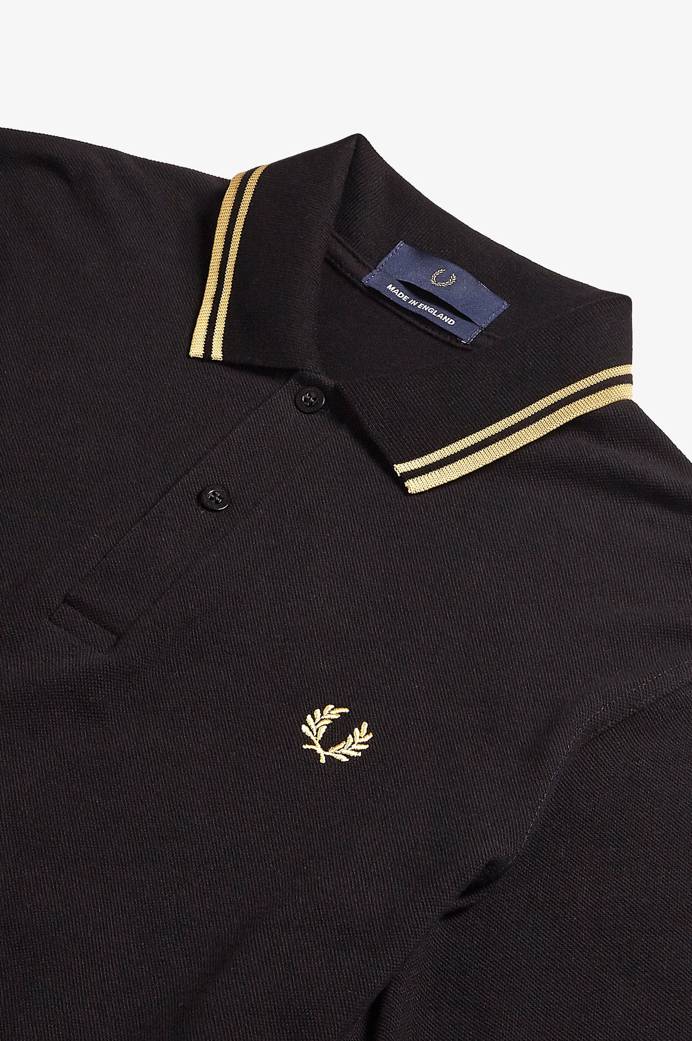fred perry black and gold polo shirt