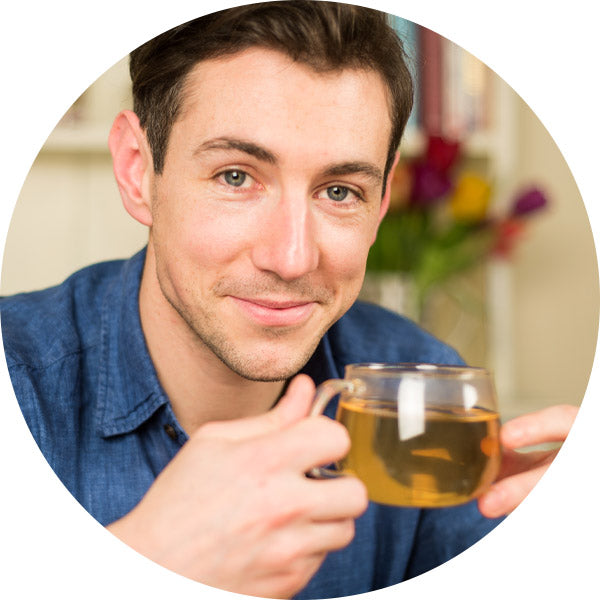 man drinking green tea