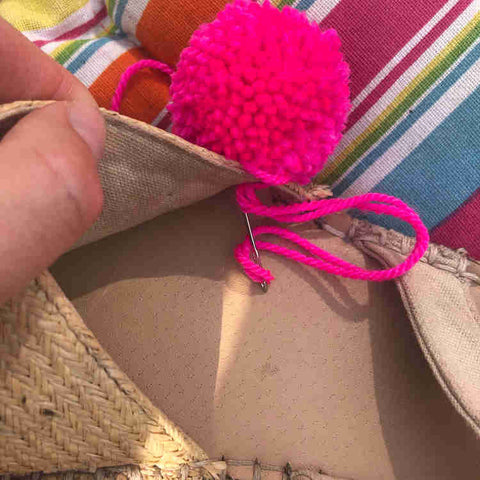 Sew pom poms on to your sandals